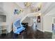 Modern glass staircase with blue lighting and hardwood floors at 100 Beach Ne Dr # 1900, St Petersburg, FL 33701