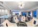 Modern dining area with glass table and white chairs at 100 Beach Ne Dr # 1900, St Petersburg, FL 33701