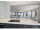 Modern kitchen with sleek countertops, stainless steel appliances, and breakfast bar at 100 Beach Ne Dr # 1900, St Petersburg, FL 33701