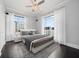Bedroom with hardwood floors, large windows, and city views at 100 Beach Ne Dr # 1900, St Petersburg, FL 33701