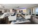 Spacious living room with city views, modern decor, and a sleek kitchen bar at 100 Beach Ne Dr # 1900, St Petersburg, FL 33701