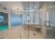 Spa-inspired bathroom with a walk-in shower and pebble flooring at 100 Beach Ne Dr # 1900, St Petersburg, FL 33701