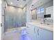 Modern bathroom with a glass shower, quartz countertop, and LED lighting at 100 Beach Ne Dr # 1900, St Petersburg, FL 33701