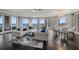 Elegant living room with hardwood floors, city views, and upscale furnishings at 100 Beach Ne Dr # 1900, St Petersburg, FL 33701