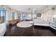 Bright main bedroom with a king bed, sitting area, and expansive city views at 100 Beach Ne Dr # 1900, St Petersburg, FL 33701
