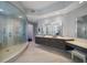 Elegant bathroom with double vanities and a large shower at 100 Beach Ne Dr # 1900, St Petersburg, FL 33701