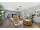 Open living room showcasing hardwood floors and a view into the dining area at 5523 Carlton Rd, New Port Richey, FL 34652