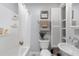 Clean bathroom with a shower/tub combo, and built-in shelving at 5523 Carlton Rd, New Port Richey, FL 34652
