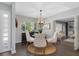 Bright dining room with four chairs and view into living room at 5523 Carlton Rd, New Port Richey, FL 34652