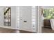 Bright entryway with a white door and tiled floors at 5523 Carlton Rd, New Port Richey, FL 34652