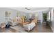 Bright living room with hardwood floors, comfy seating, and stylish decor at 5523 Carlton Rd, New Port Richey, FL 34652