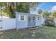 Gray storage shed with white trim and double doors at 5523 Carlton Rd, New Port Richey, FL 34652