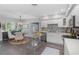Modern kitchen with stainless steel island, white cabinets, and breakfast nook at 5523 Carlton Rd, New Port Richey, FL 34652