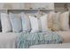 Close up of a bed with an array of decorative pillows at 5523 Carlton Rd, New Port Richey, FL 34652