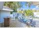 Relaxing backyard deck with seating area and a view of trees at 5523 Carlton Rd, New Port Richey, FL 34652