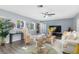 Living room with hardwood floors, comfortable seating, and a large TV at 5523 Carlton Rd, New Port Richey, FL 34652