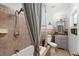 Clean bathroom with tile shower, tub, and gray vanity at 5523 Carlton Rd, New Port Richey, FL 34652