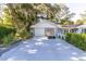 House's front view, showcasing a driveway and two-car garage at 5523 Carlton Rd, New Port Richey, FL 34652