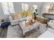 Living room with light gray sofa and a wooden coffee table at 5523 Carlton Rd, New Port Richey, FL 34652