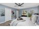 Primary bedroom with ceiling fan and en-suite bathroom at 5523 Carlton Rd, New Port Richey, FL 34652