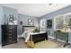 Cozy bedroom with dresser and comfortable bed at 5523 Carlton Rd, New Port Richey, FL 34652
