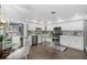 Modern kitchen with white cabinets, stainless steel appliances, and a kitchen island at 5523 Carlton Rd, New Port Richey, FL 34652