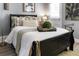 Bedroom with a dark wood sleigh bed and soft bedding at 5523 Carlton Rd, New Port Richey, FL 34652