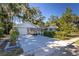 Two-car garage with driveway and neatly trimmed hedges at 5523 Carlton Rd, New Port Richey, FL 34652