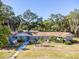 One-story home, featuring a large front yard and walkway at 5523 Carlton Rd, New Port Richey, FL 34652