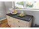 White dresser with decorative items including plants and candles at 5523 Carlton Rd, New Port Richey, FL 34652