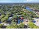 Aerial view showing home's location in a wooded area at 5523 Carlton Rd, New Port Richey, FL 34652
