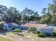 Ranch style home with lush landscaping and driveway at 5523 Carlton Rd, New Port Richey, FL 34652