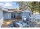 Wooden deck with patio furniture and a shed in background at 5523 Carlton Rd, New Port Richey, FL 34652