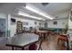 Community recreation room with pool table and card tables at 4239 Tamargo Dr, New Port Richey, FL 34652
