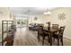 Spacious dining area with hardwood floors and a view to the living room at 4239 Tamargo Dr, New Port Richey, FL 34652