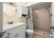 Updated bathroom with a walk-in shower and white vanity at 4239 Tamargo Dr, New Port Richey, FL 34652