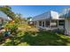 Exterior view of building with metal roof and landscaping at 4239 Tamargo Dr, New Port Richey, FL 34652