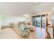 Open living area with hardwood floors, comfortable seating and water views at 736 Island Way # 404, Clearwater Beach, FL 33767