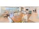Open dining area with wood table and access to living room at 736 Island Way # 404, Clearwater Beach, FL 33767