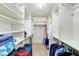Spacious walk-in closet with ample shelving and hanging space at 736 Island Way # 404, Clearwater Beach, FL 33767