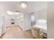 Bright kitchen with white cabinets, island, and wood-look floors at 736 Island Way # 404, Clearwater Beach, FL 33767