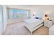 Bright bedroom with water view and comfortable furnishings at 736 Island Way # 404, Clearwater Beach, FL 33767