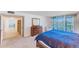 Main bedroom with water views and built-in shelving at 736 Island Way # 404, Clearwater Beach, FL 33767