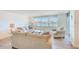 Living room with water views and comfortable seating at 736 Island Way # 404, Clearwater Beach, FL 33767