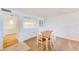 Bright dining area with wood table and white chairs at 736 Island Way # 404, Clearwater Beach, FL 33767