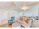 Spacious living room features light floors and comfortable seating at 736 Island Way # 404, Clearwater Beach, FL 33767