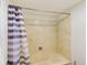 Clean bathroom with shower/tub and striped shower curtain at 736 Island Way # 404, Clearwater Beach, FL 33767