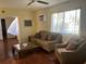 Living room with stained concrete floors and couches at 229 44Th Ave, St Pete Beach, FL 33706