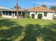 House exterior showcasing a spacious backyard at 229 44Th Ave, St Pete Beach, FL 33706