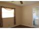 Bedroom with window, hardwood floors, and bathroom access at 4251 100Th N Ave # 2, Pinellas Park, FL 33782